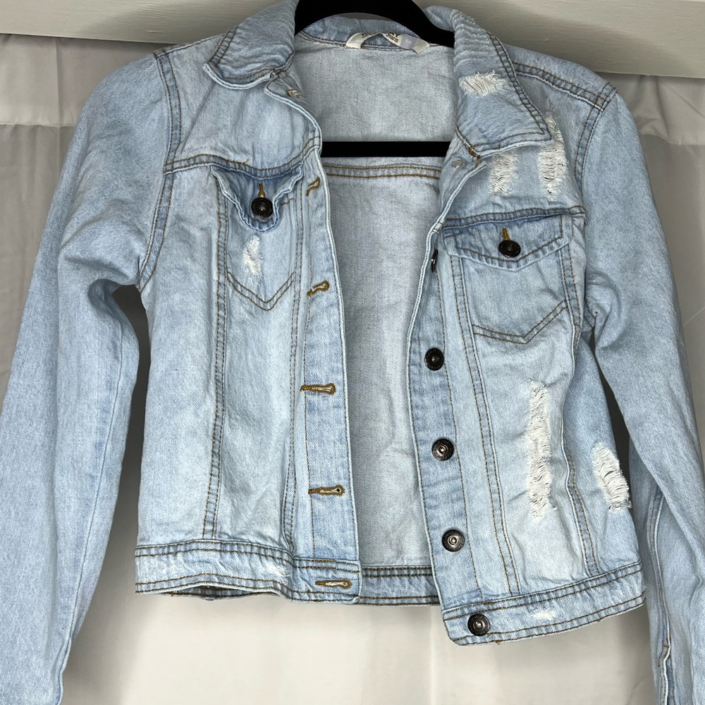 Distressed jeans jacket perfect for layering !